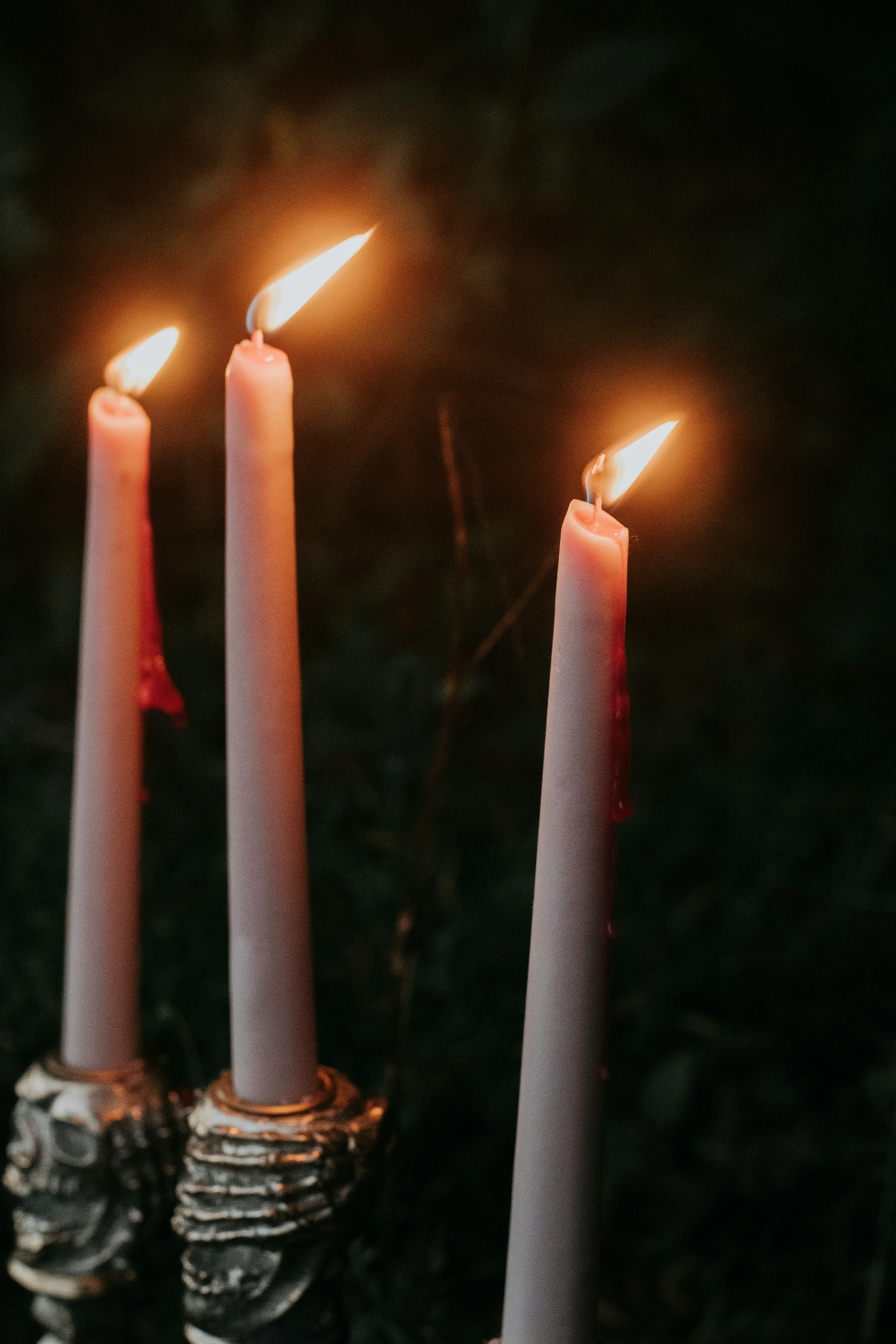 A lit candle in soft light